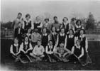 The lacrosse team. School is on the right in the background; swimming pool on the left behind the team. Jean took this photo with her "Brownie" camera.